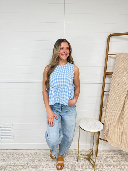 blue gingham babydoll top with side tie detail, lightweight summer top for women styled with denim jeans