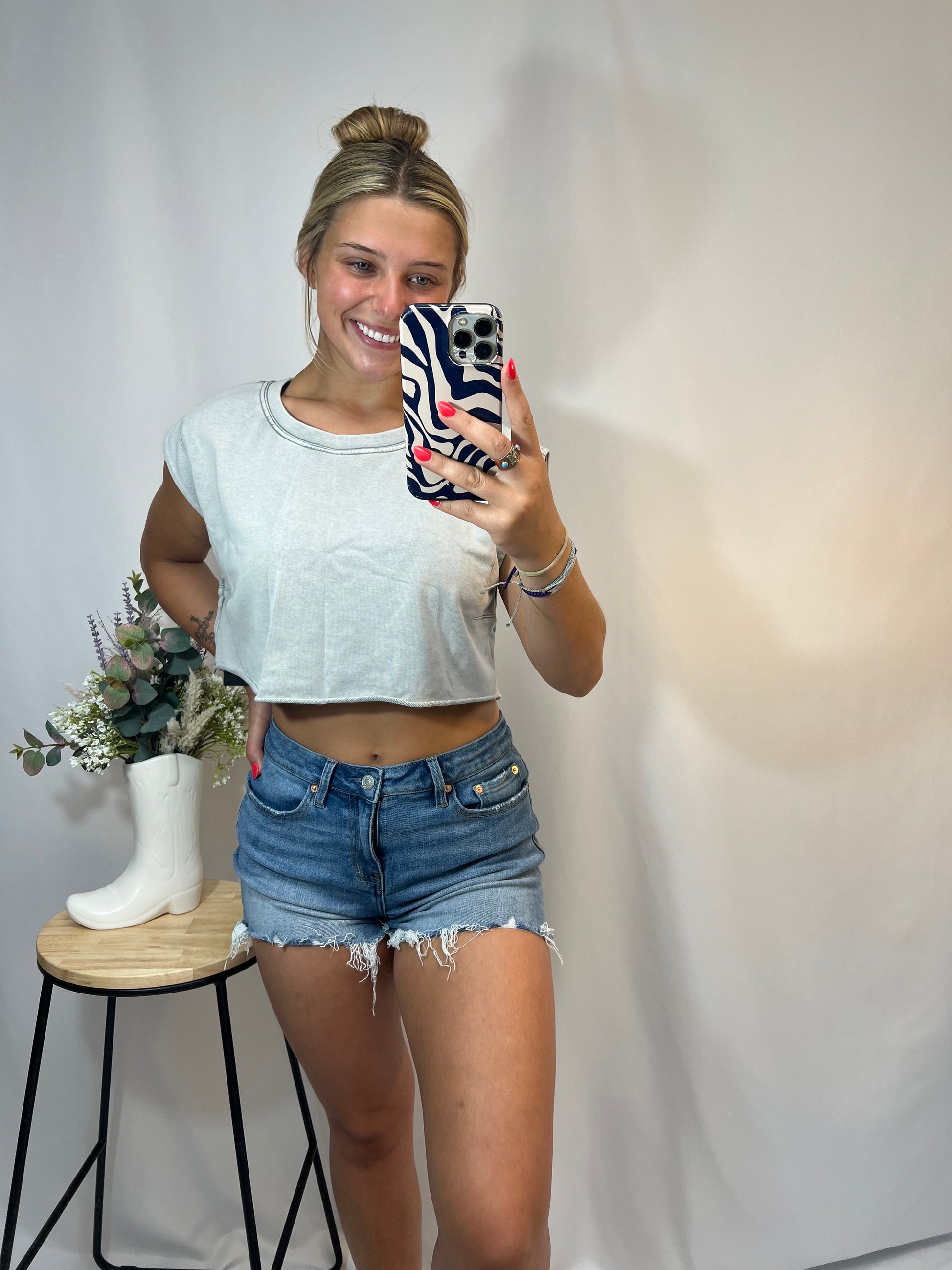 high rise distressed criss cross denim shorts, women’s vintage washed jean shorts with side lace-up detail