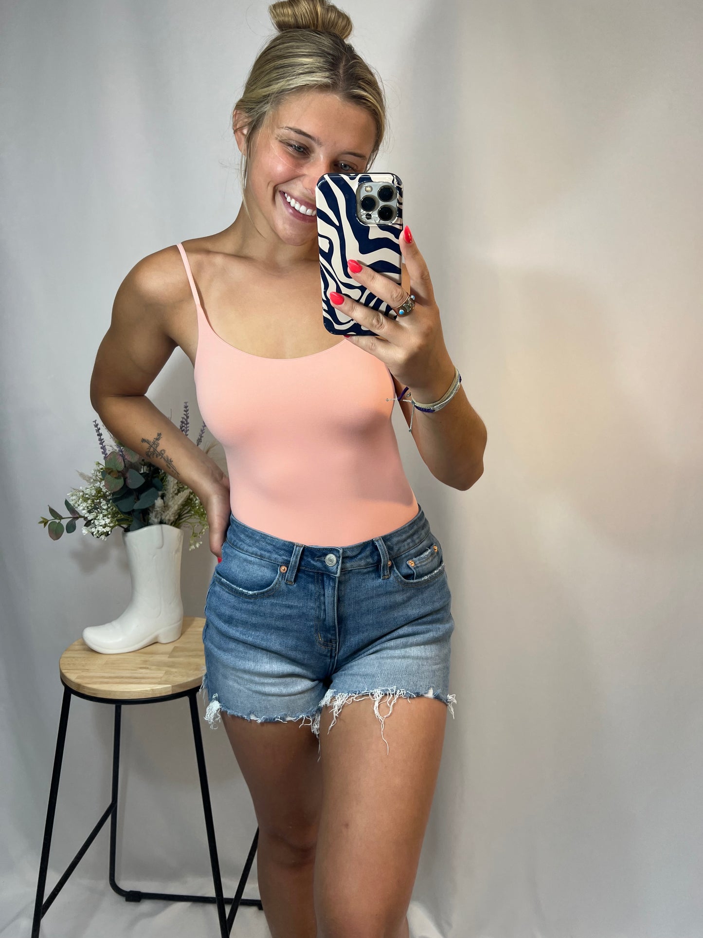 Peach seamless ribbed bodysuit, women’s one-piece fitted knit underlayer without seams