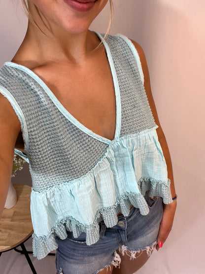 Close-up of mint sleeveless thermal babydoll tank, women’s cropped waffle knit top with flowy fit
