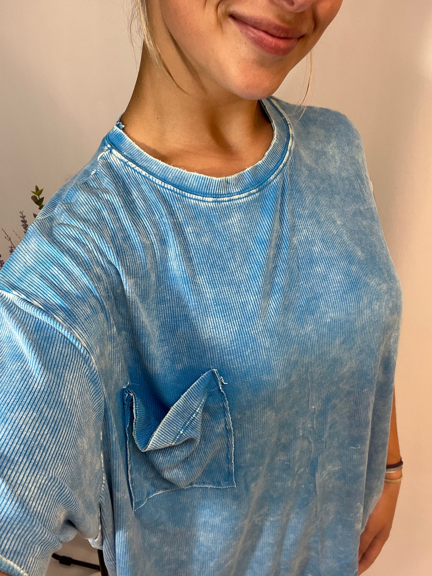 Close up of slouchy oversized tee with front pocket, women’s relaxed cotton t-shirt with pocket