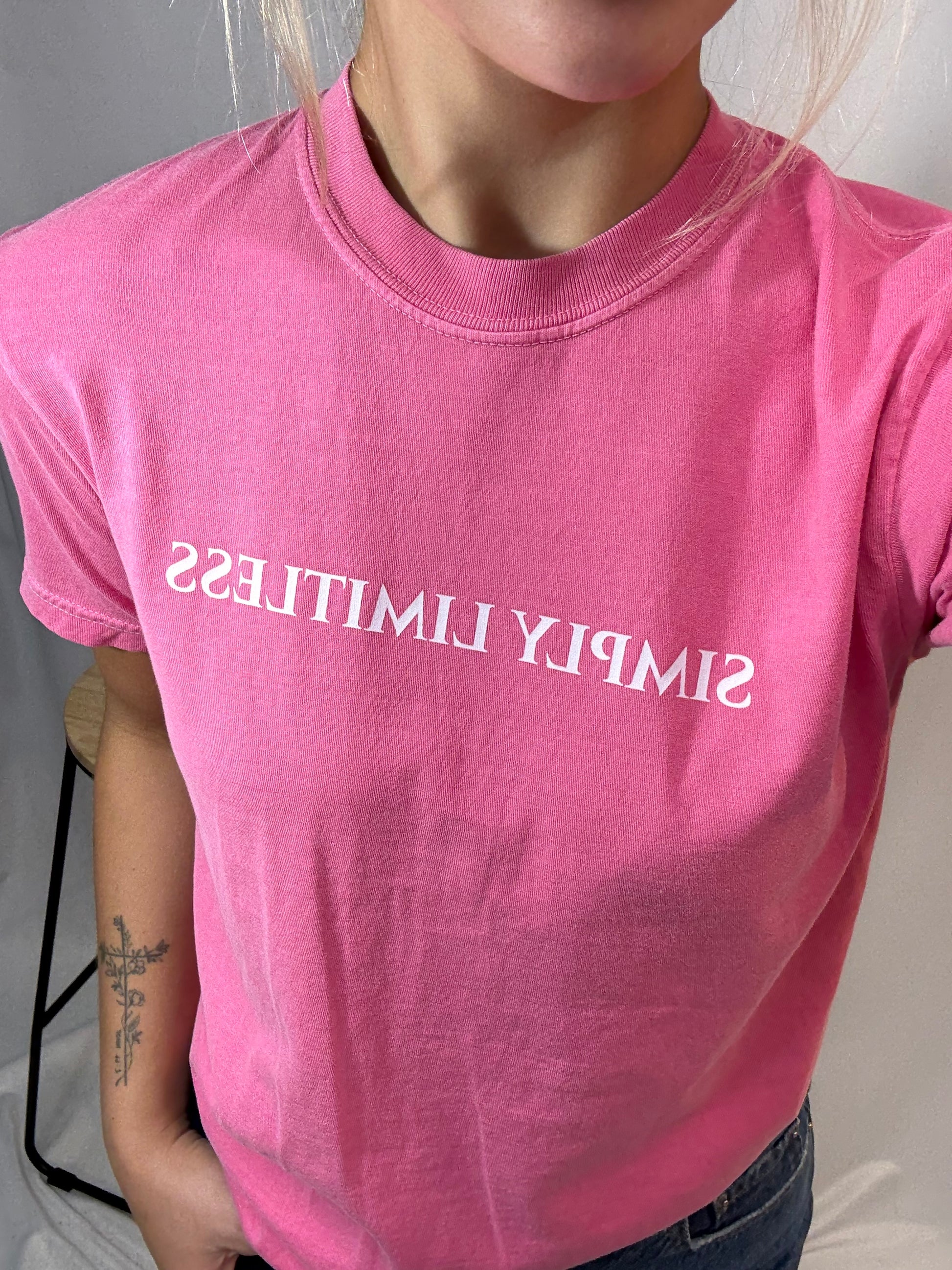 Close up pink Simply Limitless tee, women’s soft cotton graphic t-shirt in light pink