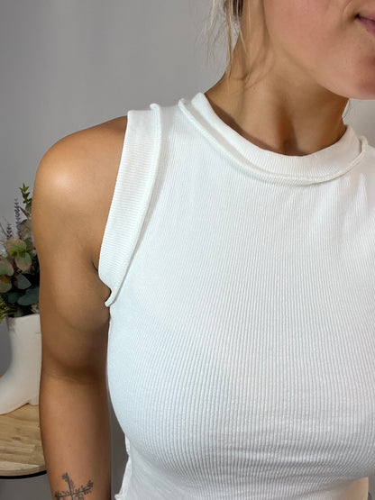 Close-up of white ribbed sleeveless tank, women’s stretch knit tank top with ribbed texture
