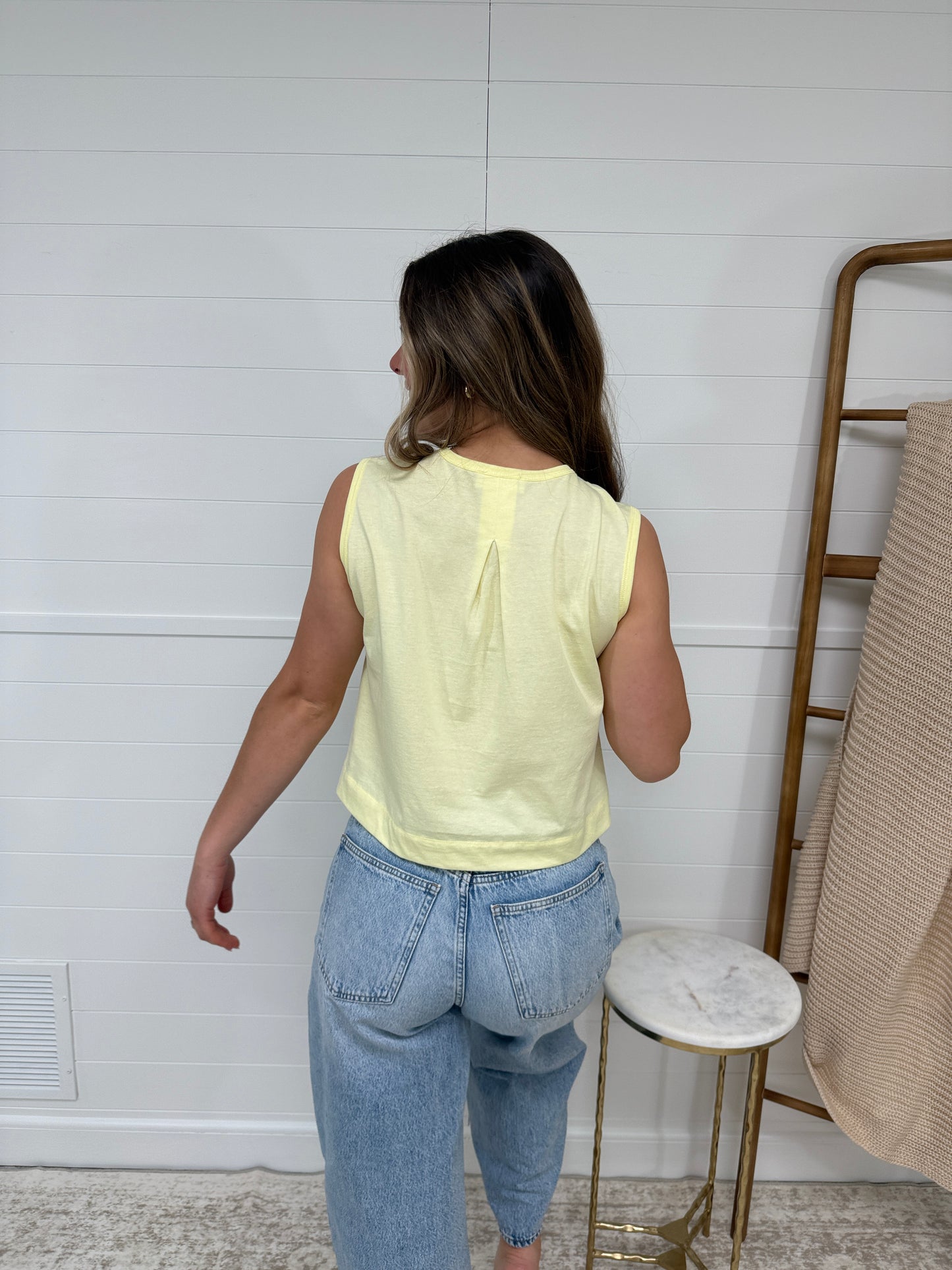pastel yellow sleeveless tank top for women, lightweight summer top styled with denim jeans, casual cute outfit