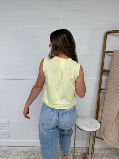 pastel yellow sleeveless tank top for women, lightweight summer top styled with denim jeans, casual cute outfit