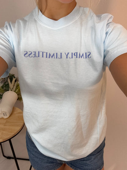 Close up blue Simply Limitless tee, women’s soft cotton graphic t-shirt in light blue