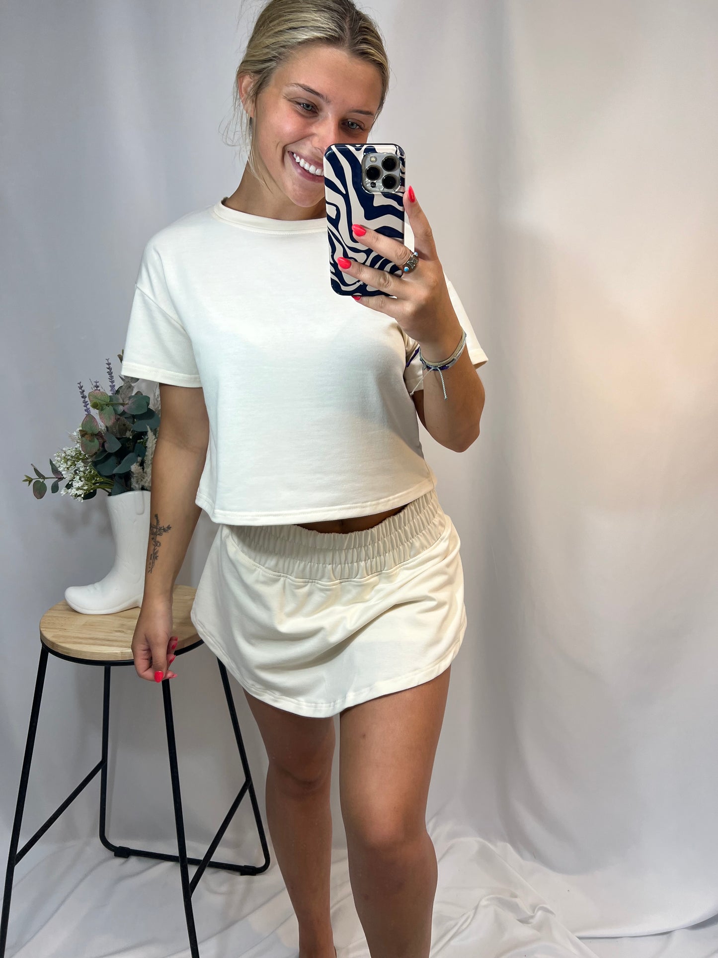 Ivory cropped tee and ruffle high-waist skort set, women’s matching top and skirt shorts outfit