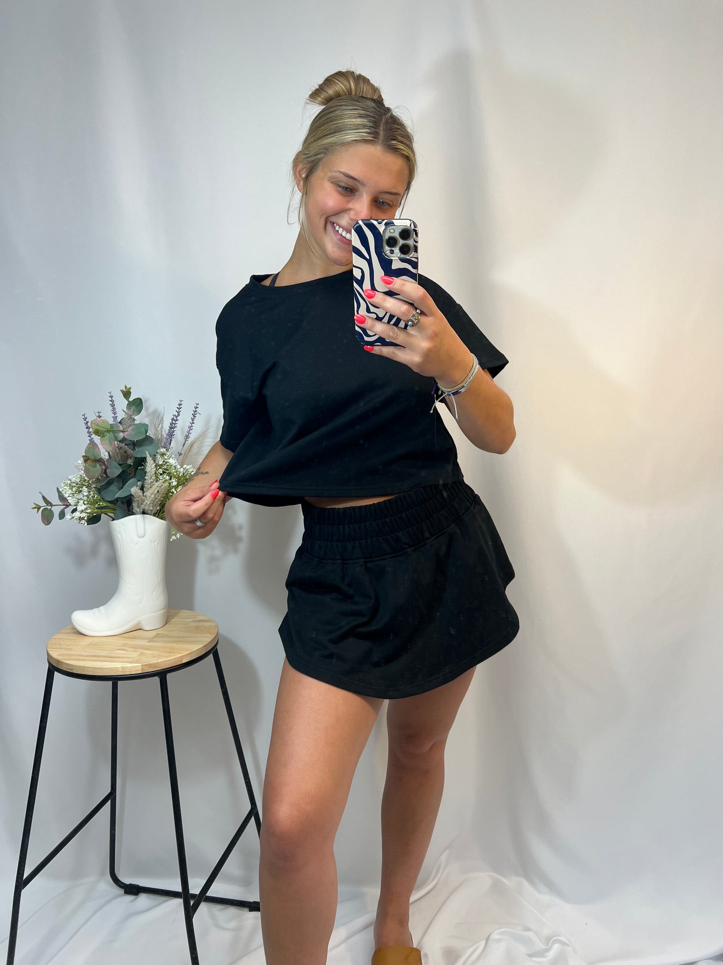 Black cropped tee and ruffle high-waist skort set, women’s matching top and skirt shorts outfit