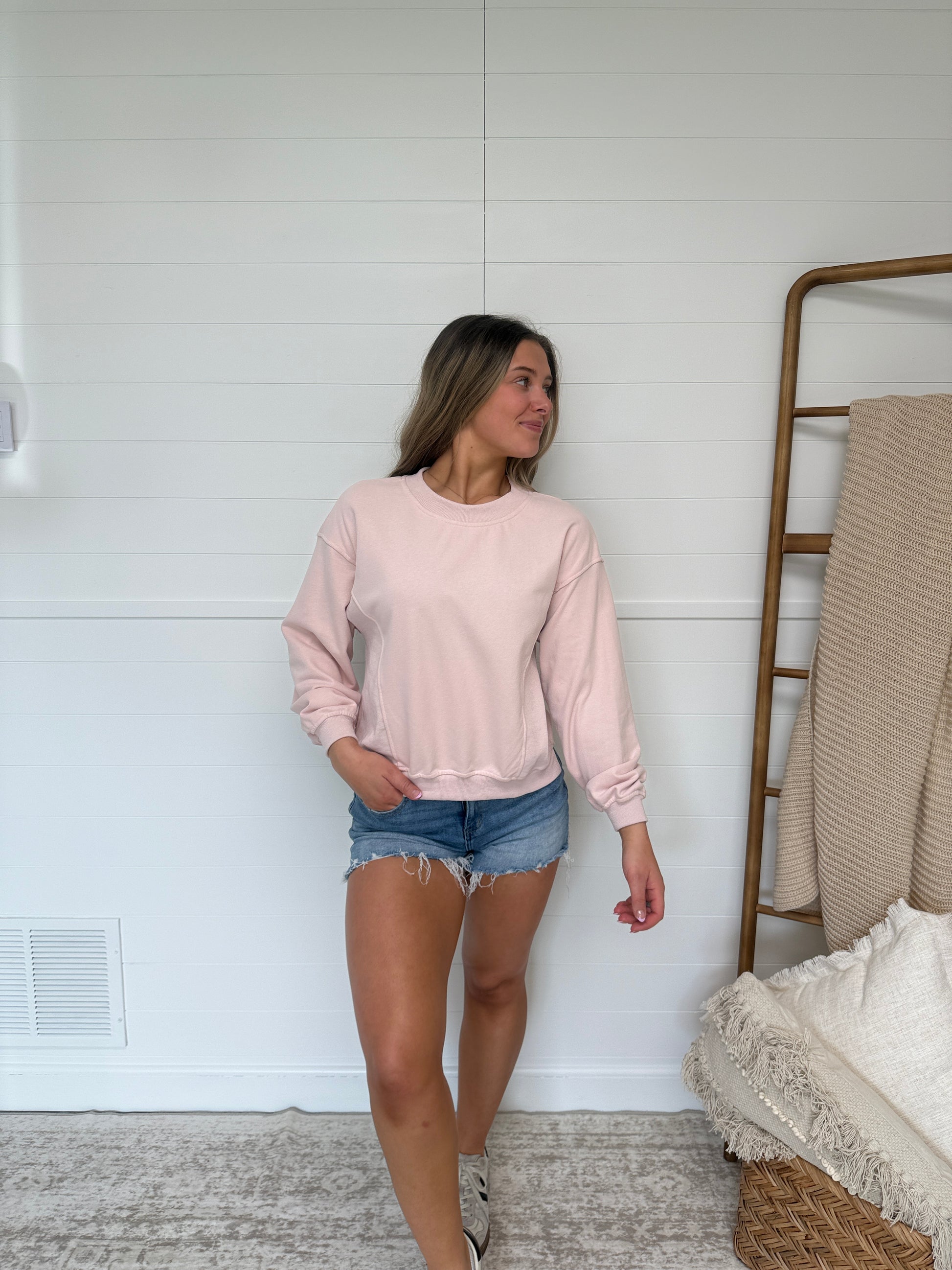 women’s pink crewneck, lightweight sweatshirt with ribbed neckline and relaxed fit casual look