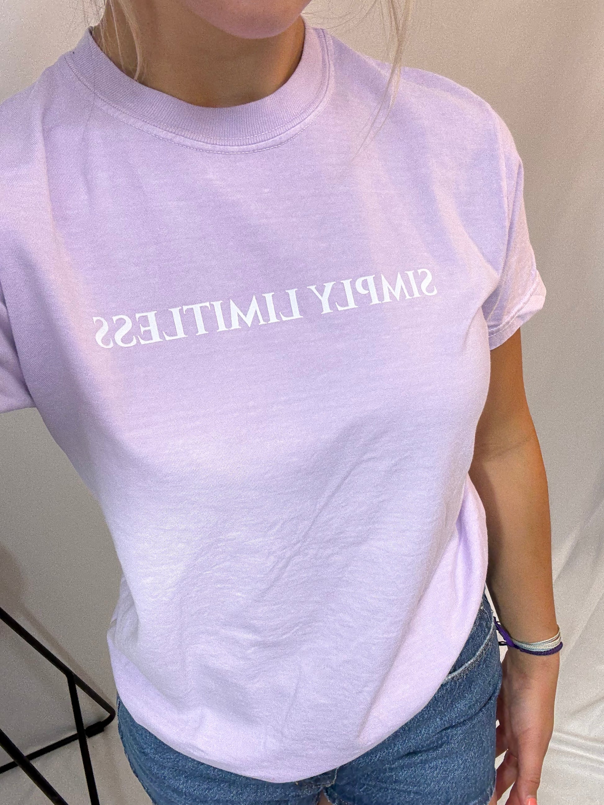 Close up orchid-colored Simply Limitless tee, soft vintage-style women’s graphic t-shirt