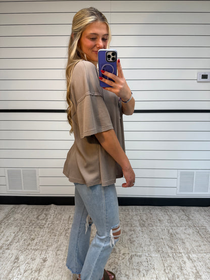 Side view of soft plume henley top, women’s relaxed knit shirt with button placket and long sleeves