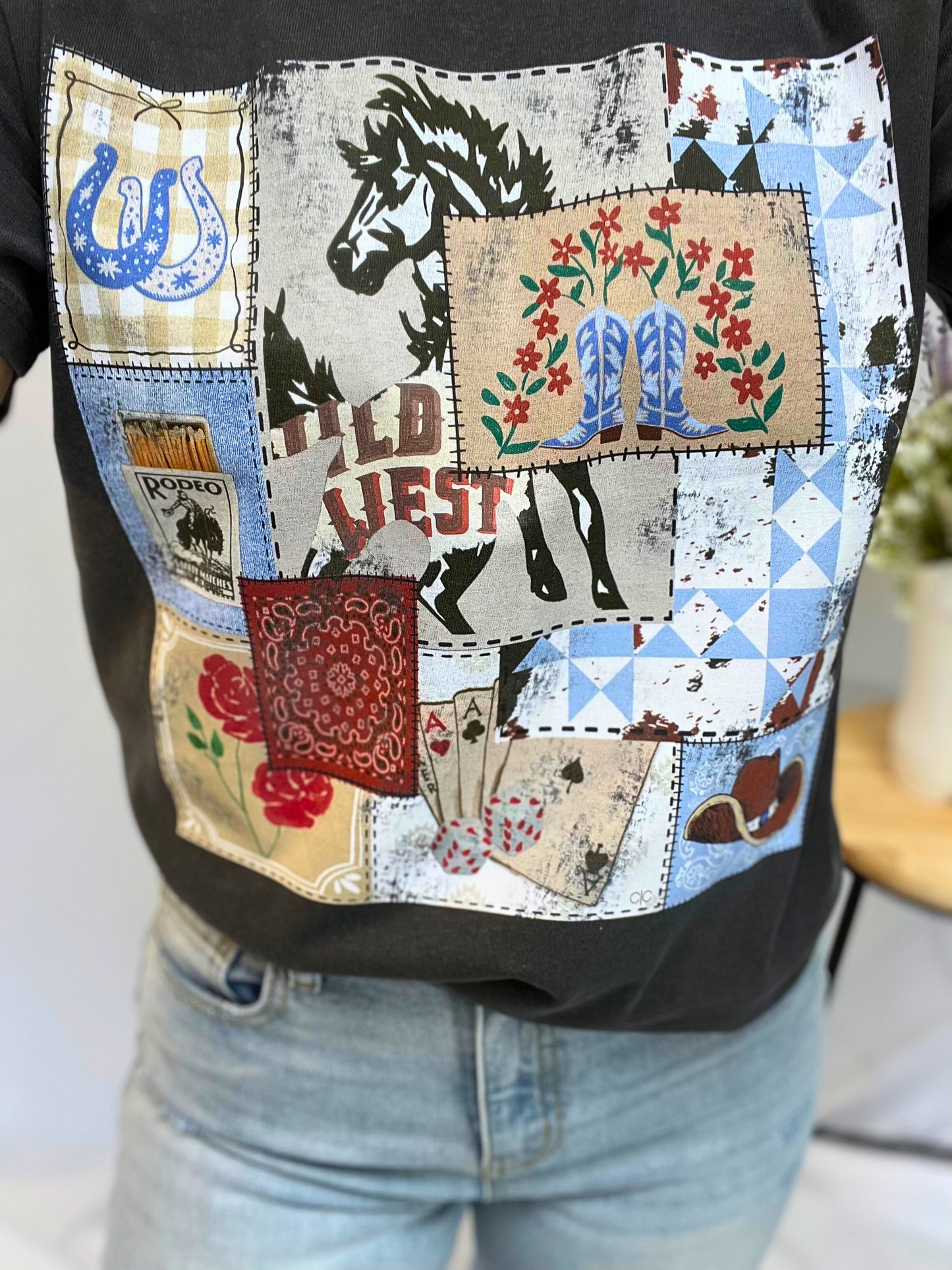 Close-up of rodeo patch tee, women’s western-style t-shirt with embroidered rodeo patch on chest