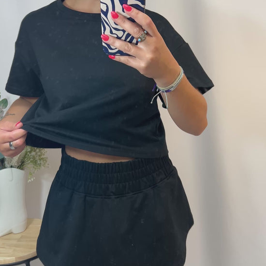 Black cropped tee and ruffle high-waist skort set, women’s matching top and skirt shorts outfit