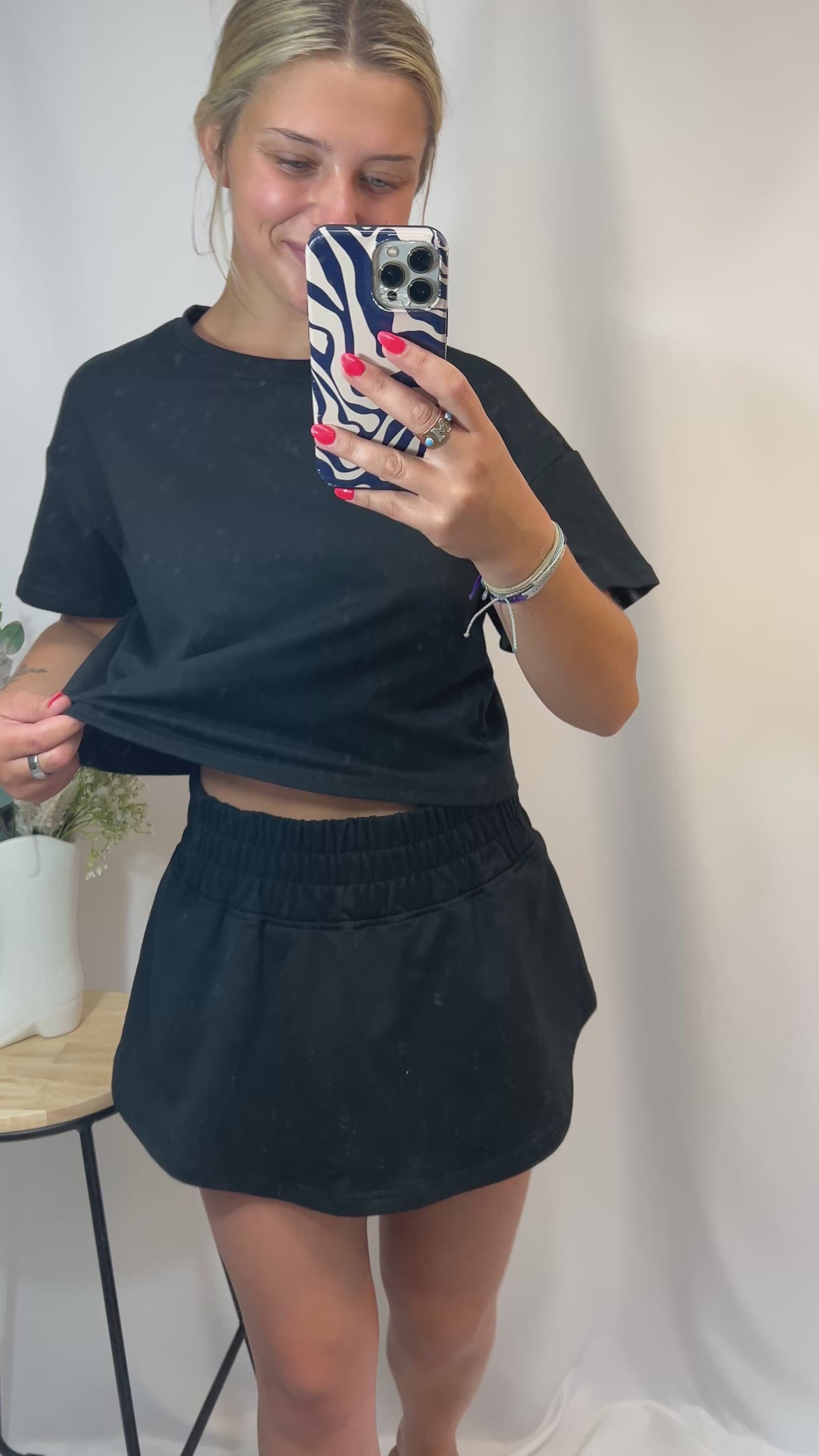 Black cropped tee and ruffle high-waist skort set, women’s matching top and skirt shorts outfit