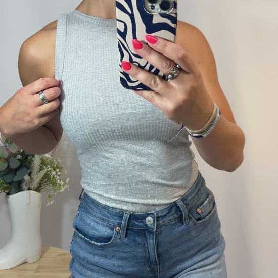 Close-up of soft ribbed high neck tank, women’s ribbed knit sleeveless high neckline top
