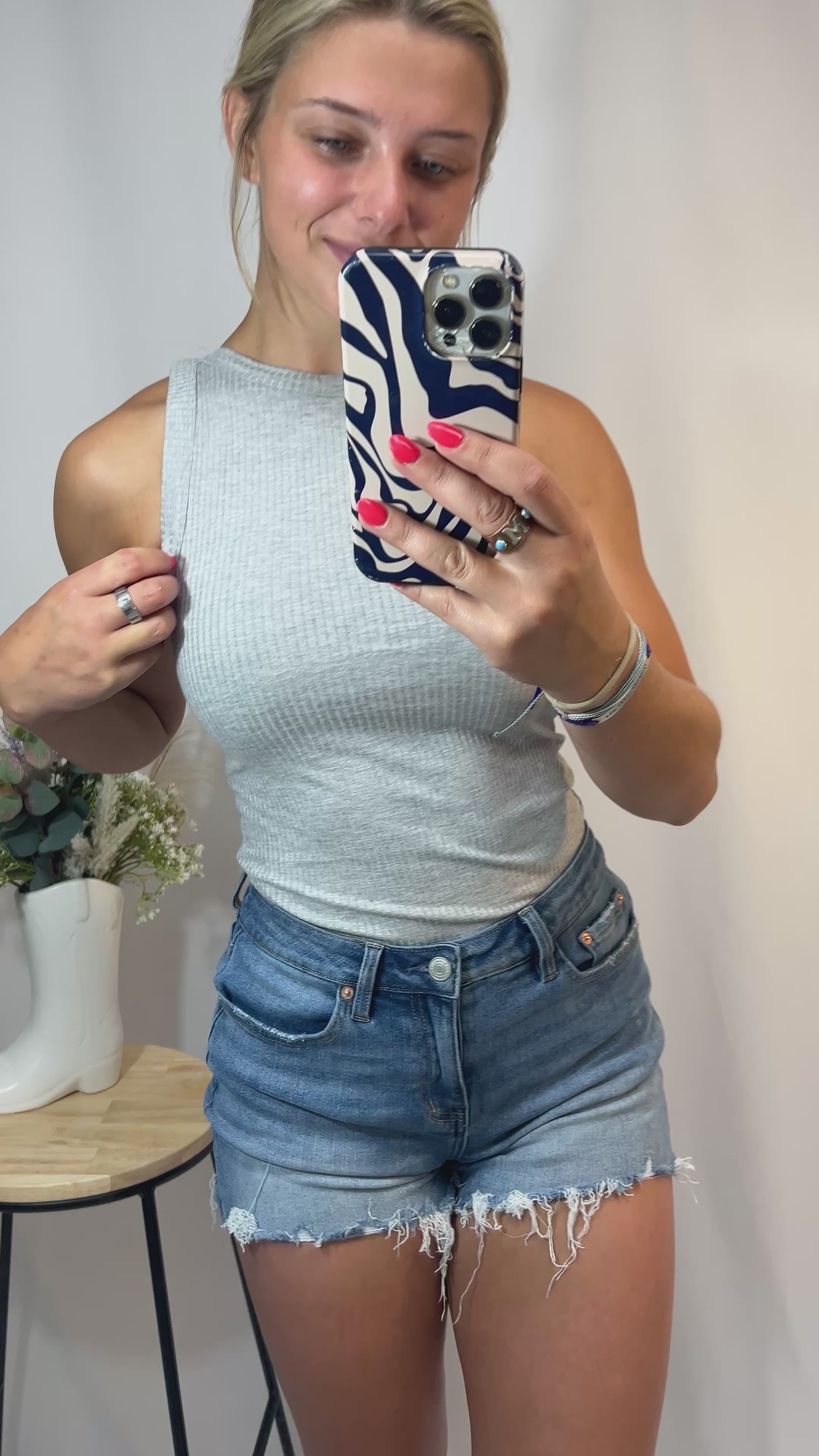 Close-up of soft ribbed high neck tank, women’s ribbed knit sleeveless high neckline top
